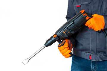 Hands in protective gloves with hammer drill, perforator