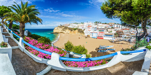 Carvoeiro town with colorful houses and yellow sand beach in Algarve, Portugal - obrazy, fototapety, plakaty