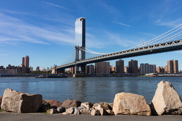 Manhattan Bridge over the East River in New York City seen from the Dumbo Brooklyn Riverfront with...