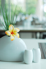 Frangipani flower on dining table setting