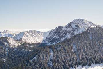 Fototapeta na wymiar Snow-covered mountains in winter