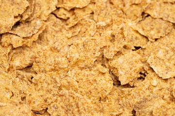 Corn-flakes background and texture, cornflake cereal box for morning breakfast. Macro shot. Selective focus.