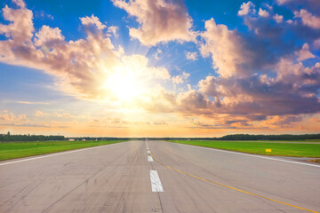 Wide runway view of the sun in the sky above the beautiful horizon, concept, future success...