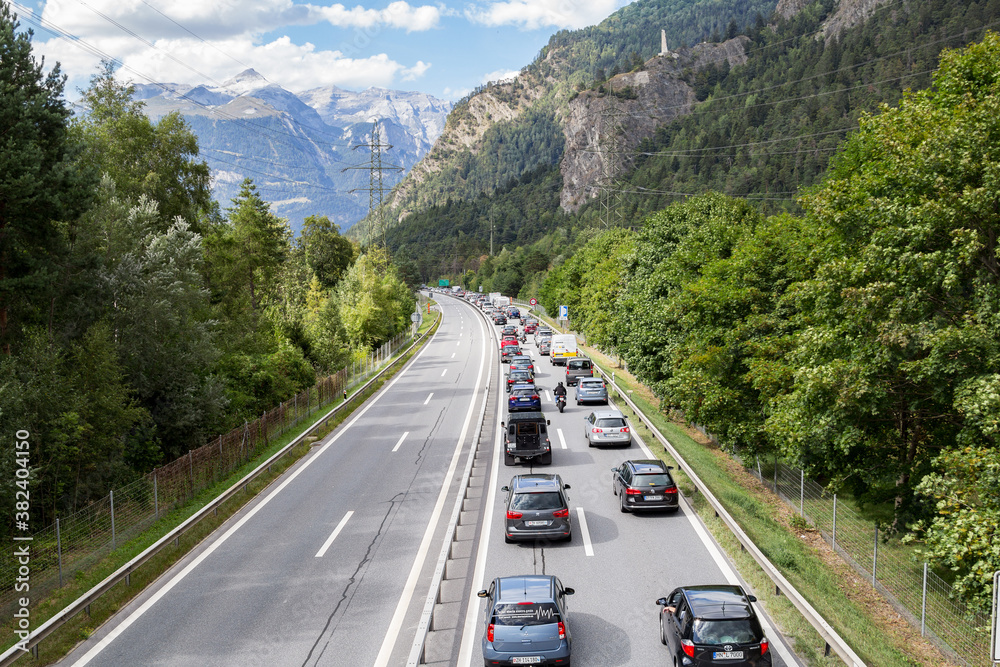 Wall mural Rothenbrunnen, Switzerland: 12 August 2018 - Weekend traffic jam on the highway towards Swiss Alps creation regions, there is no contraflow in direction to metroplises.