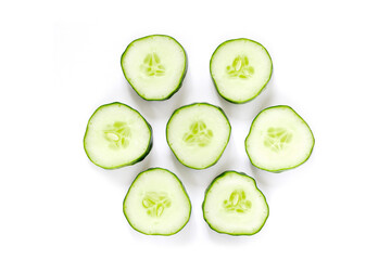 top view of fresh cucumber cut into circles isolated on a white background.