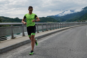 triathlon athlete running on street