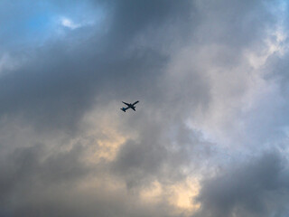 flying plane on the background of a cloudy sky