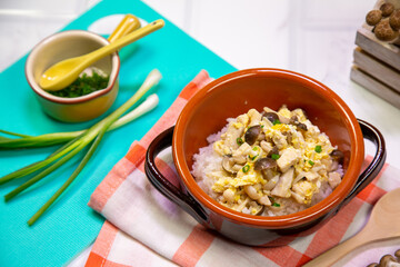 Egg fried rice with mushrooms, children's food on the table, set up appetizing.