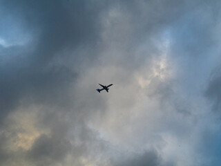 flying plane on the background of a cloudy sky