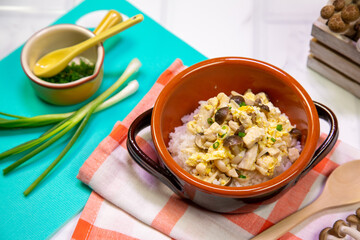 Egg fried rice with mushrooms, children's food on the table, set up appetizing.
