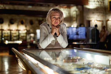 Woman exploring expositions in museum