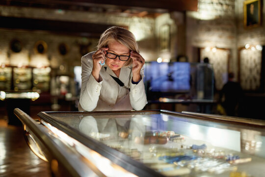 Woman exploring expositions in museum