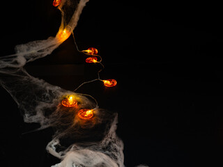 cobwebs and uces orange with halloween pumpkin shape on black background. terror