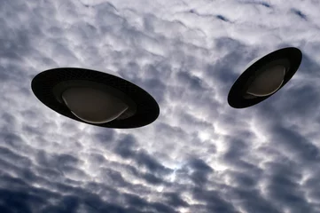 Fotobehang Concept van vliegende schotels in een bewolkte hemel © Richard Villalon