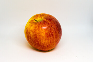 Red Gala apple close up on white background