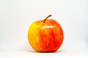 Red Gala apple close up on white background