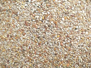 The cement wall consists of small pebbles.