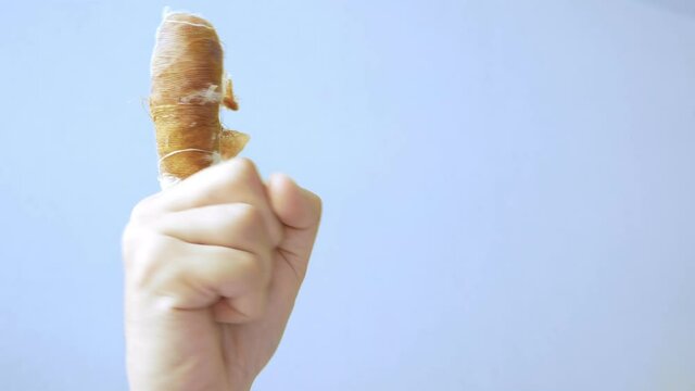 close-up. male hand gestures with a bandaged forefinger. copy space