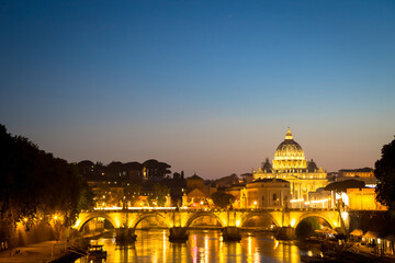 Fototapeta na wymiar Sunset on Tiber river bridge with Vatican City - Rome, Italy