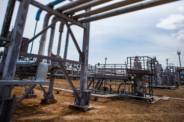 Oil refinery plant. Refinery pipelines and equipment. Tilt-shifted. Partially blurred photo. Uralsk region, Kazakhstan.
