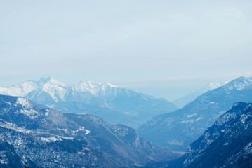 Fototapeta premium Winter landscape with mountain slopes covered with snow.