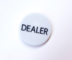 Poker dealer`s button on white background