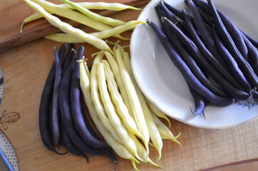 Asparagus. Green beans on a tree background.