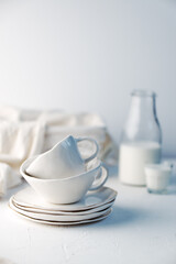 Set of white kitchenware and cooking tools over withe backgound. Still life composition.
