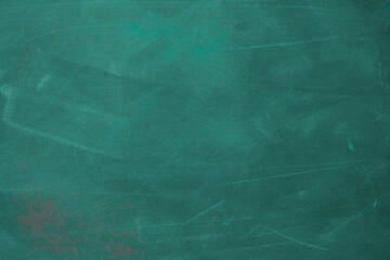 Texture of chalk rubbed out on blackboard or chalkboard background. School education, dark wall backdrop or learning concept.