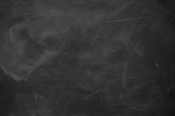 Naklejka premium Texture of chalk rubbed out on blackboard or chalkboard background. School education, dark wall backdrop or learning concept.