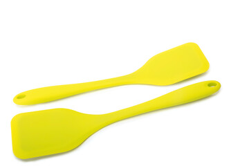 Two yellow silicon paddles for kitchen