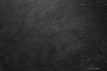 Texture of chalk rubbed out on blackboard or chalkboard background. School education, dark wall backdrop or learning concept.