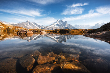 Naklejka premium Incredible view of clear water and sky reflection on Lac Blanc lake in France Alps. Monte Bianco mountains range on background. Landscape photography, Chamonix.