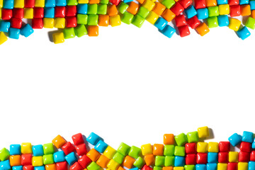 Candy.  Colorful candy frame on a white background top view frame copy space. Chewing gum, and dragees are scattered. Advertising label design element.