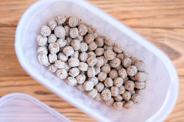 Bran in a container. Dry edible balls