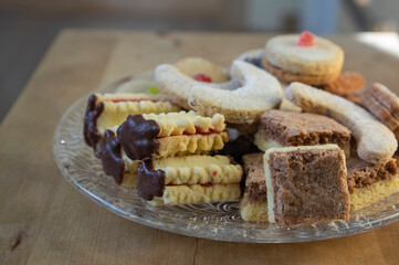 Group of delicious sweet Christmas cookies, white vanilla rolls, gingerbread, linzer and chocolate sweets wiht jam filling