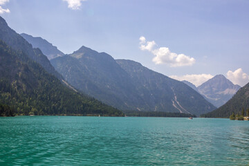 
sunny day on the turquoise Lake Plansee in the Austrian Alps