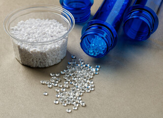 pet preforms and plastic granules on the surface