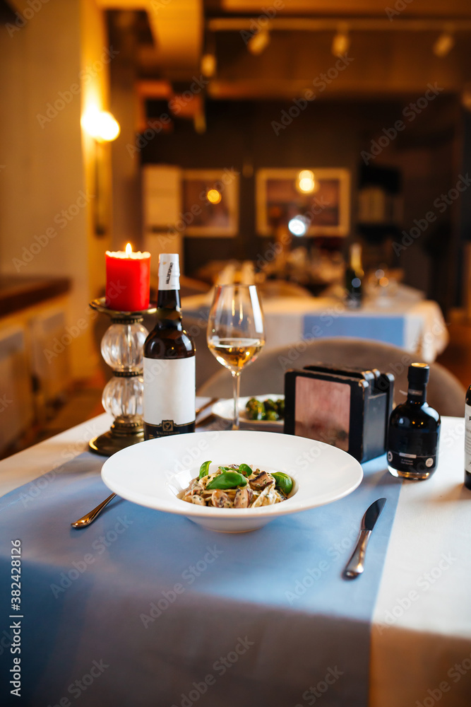 Wall mural restaurant table with tagliatelle wild mushrooms