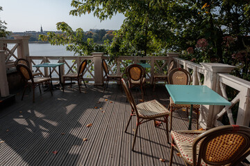 Table and chairs on the outdoor terrace, on a sunny autumn day.