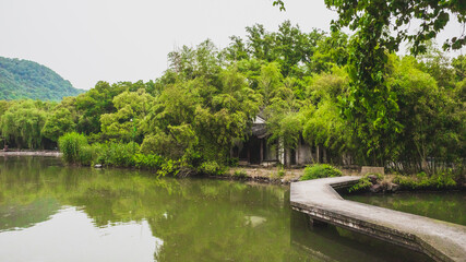 Fototapeta na wymiar Path over water in Lanting (Orchid Pavilion) scenic area in Shaoxing, China