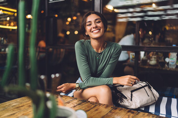 Happy woman resting in cafe
