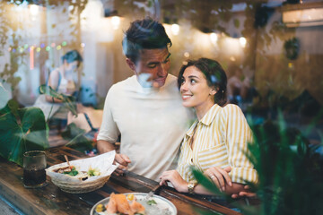 Smiling couple having date in restaurant