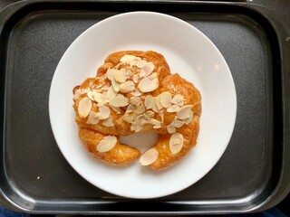 Croissant Almond Cream Cheese on black tray