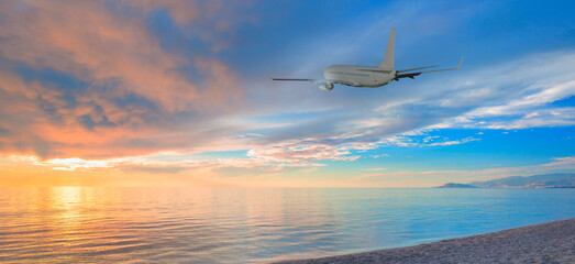 Airplane taking off from the airport - Passenger airplane flying above tropical sea at amazing...