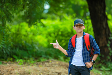 Indian cute child showing direction with hand