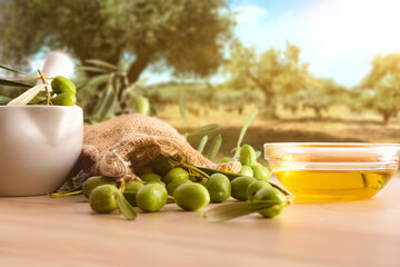 Olive oil essence for body care on table in nature