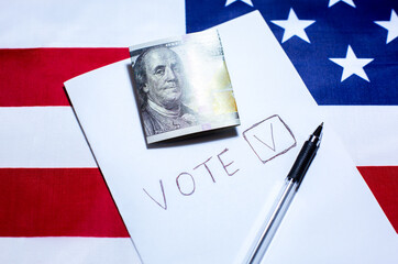 American flag with dollars on it. Elections in the USA. Paper for vote tick. Money as concept of...