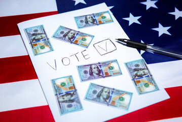 American flag with dollars on it. Elections in the USA. Bought votes. Money as concept of corruption. Unfair political changes in the country.