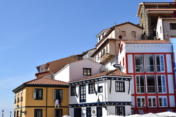 Obraz premium Little sailor town in Asturias, Spain with colorful houses near the port and the sea